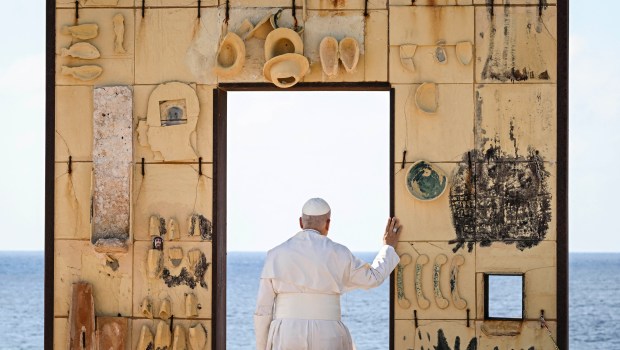 Pope Leo XIV walks trough the arch of the monument Door of Europe - Porta d'Europa made by the italian artist Mimmo Paladino, during a one day visit to Lampedusa island, south of Sicily, on July 4, 2026.