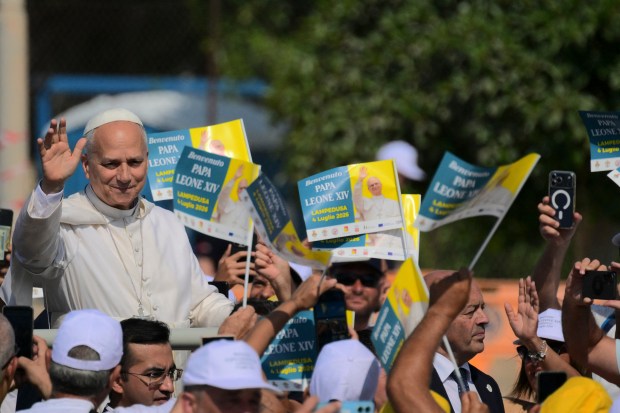 Pope Leo XIV is welcomed by faithfuls upon arrival for a mass during a one day visit to Lampedusa island, south of Sicily, on July 4, 2026.