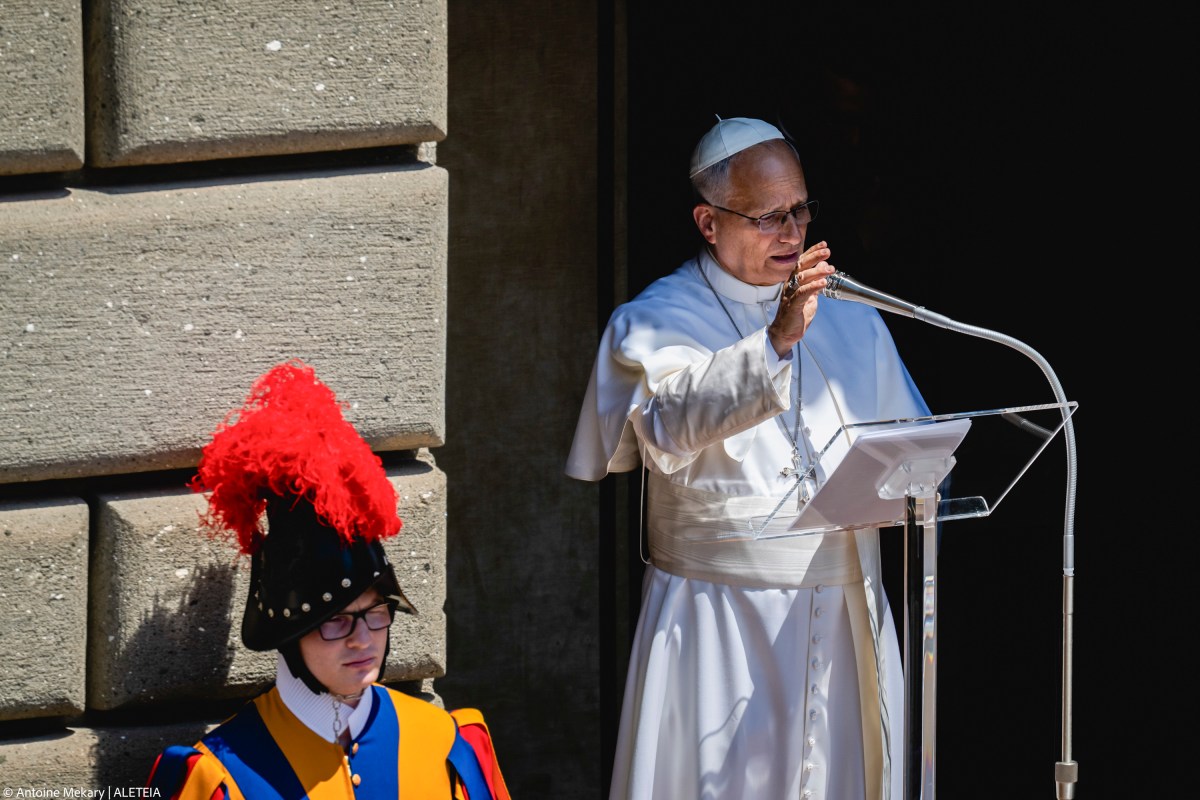 Pope Leo XIV leads the Angelus prayer from the entrance of the Apostolic Palace in Piazza della Liberta (Liberty Square)
